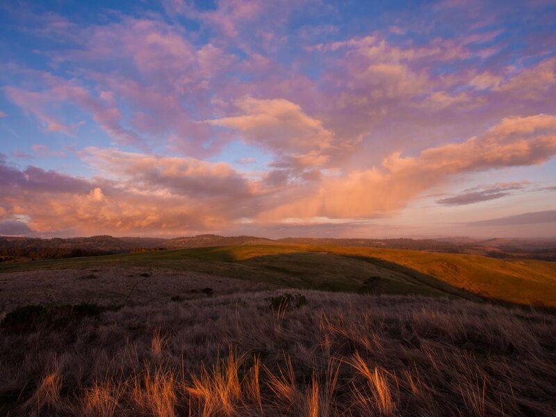 Sunset over rolling hills