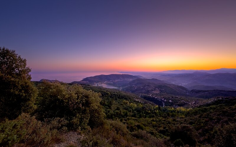 Sunset over rolling hills