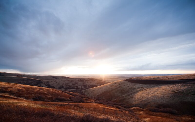 Sunset over rolling hills