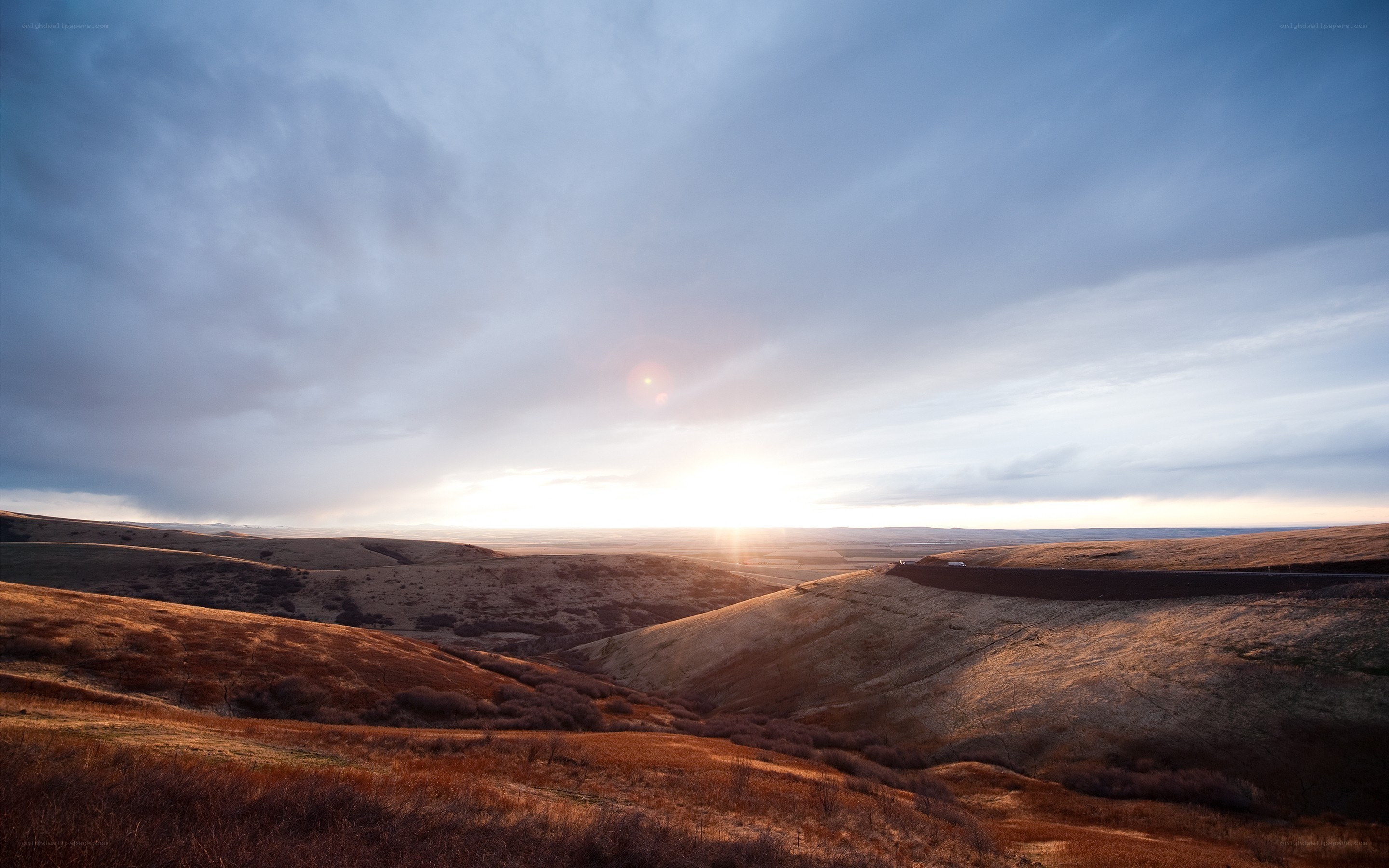 Sunset over rolling hills