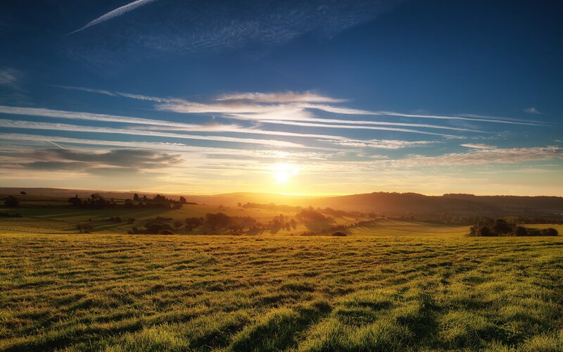 Sunset over rolling hills