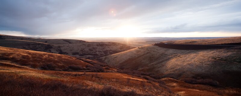 Sunset over rolling hills