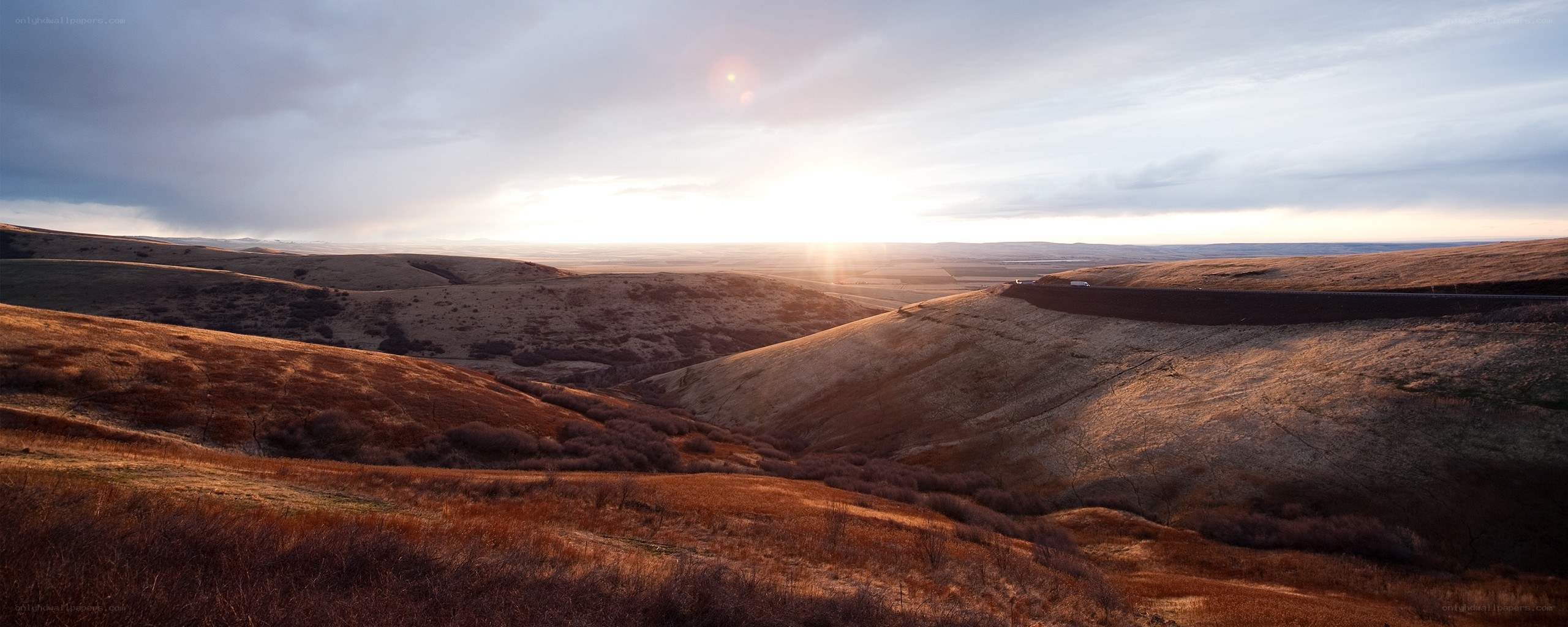 Sunset over rolling hills