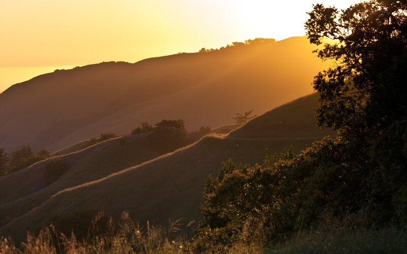 Sunset over rolling hills