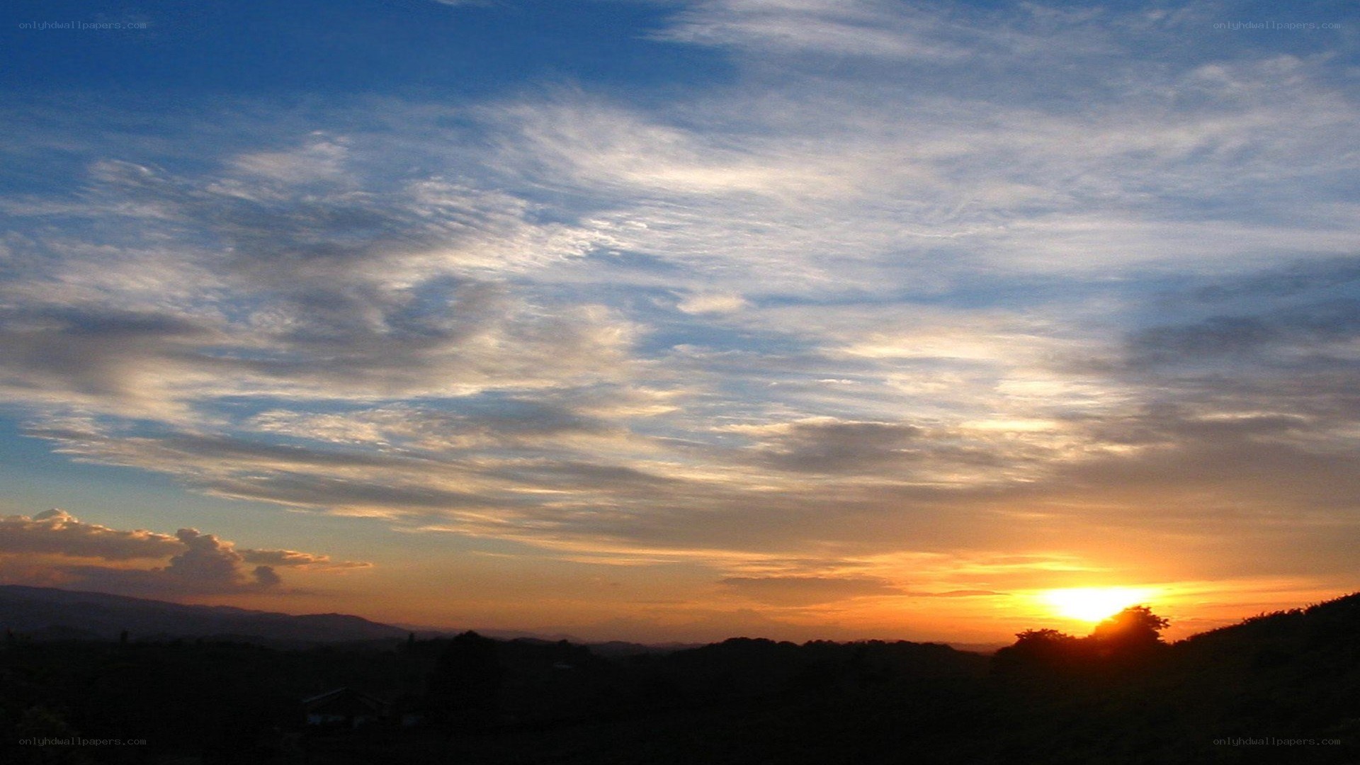 Sunset over rolling hills