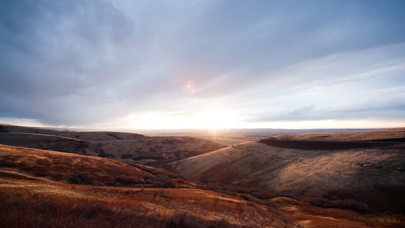 Sunset over rolling hills