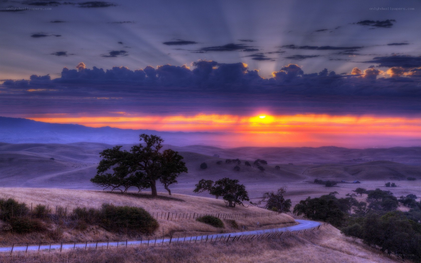 Sunset over rolling hills