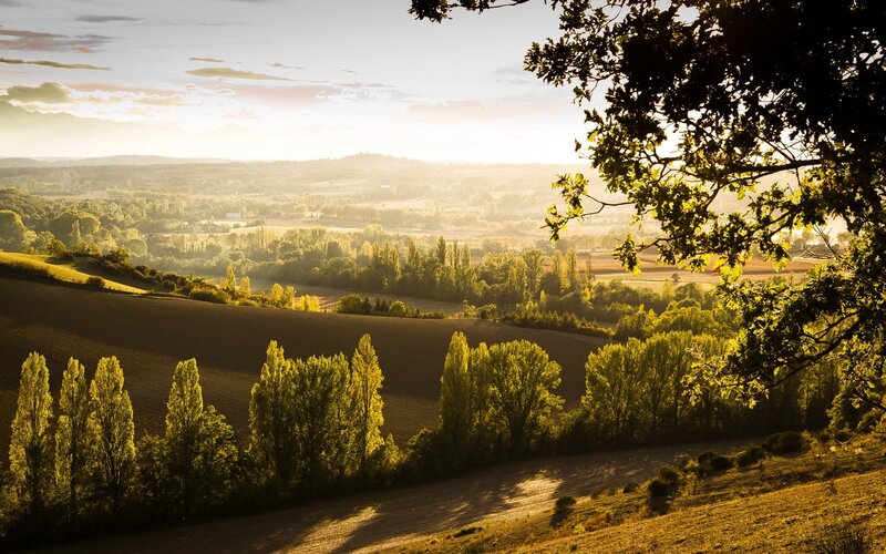 Sunset over rolling hills
