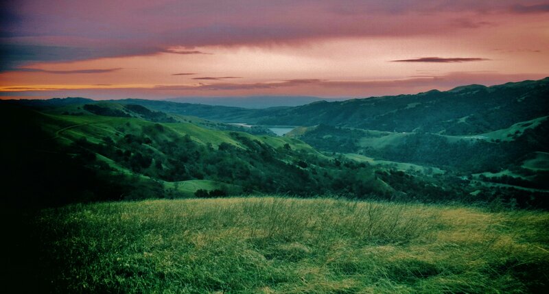 Sunset over rolling hills