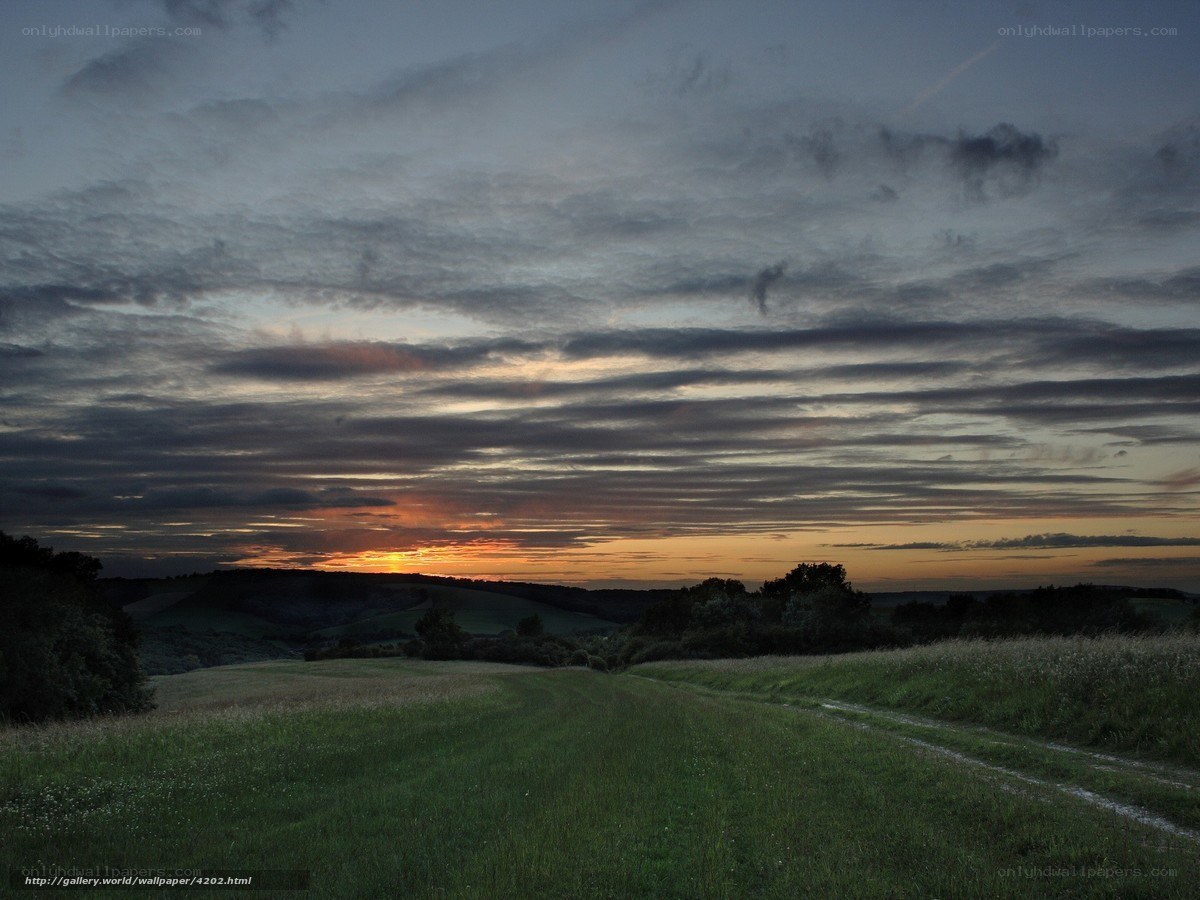 Sunset over rolling hills