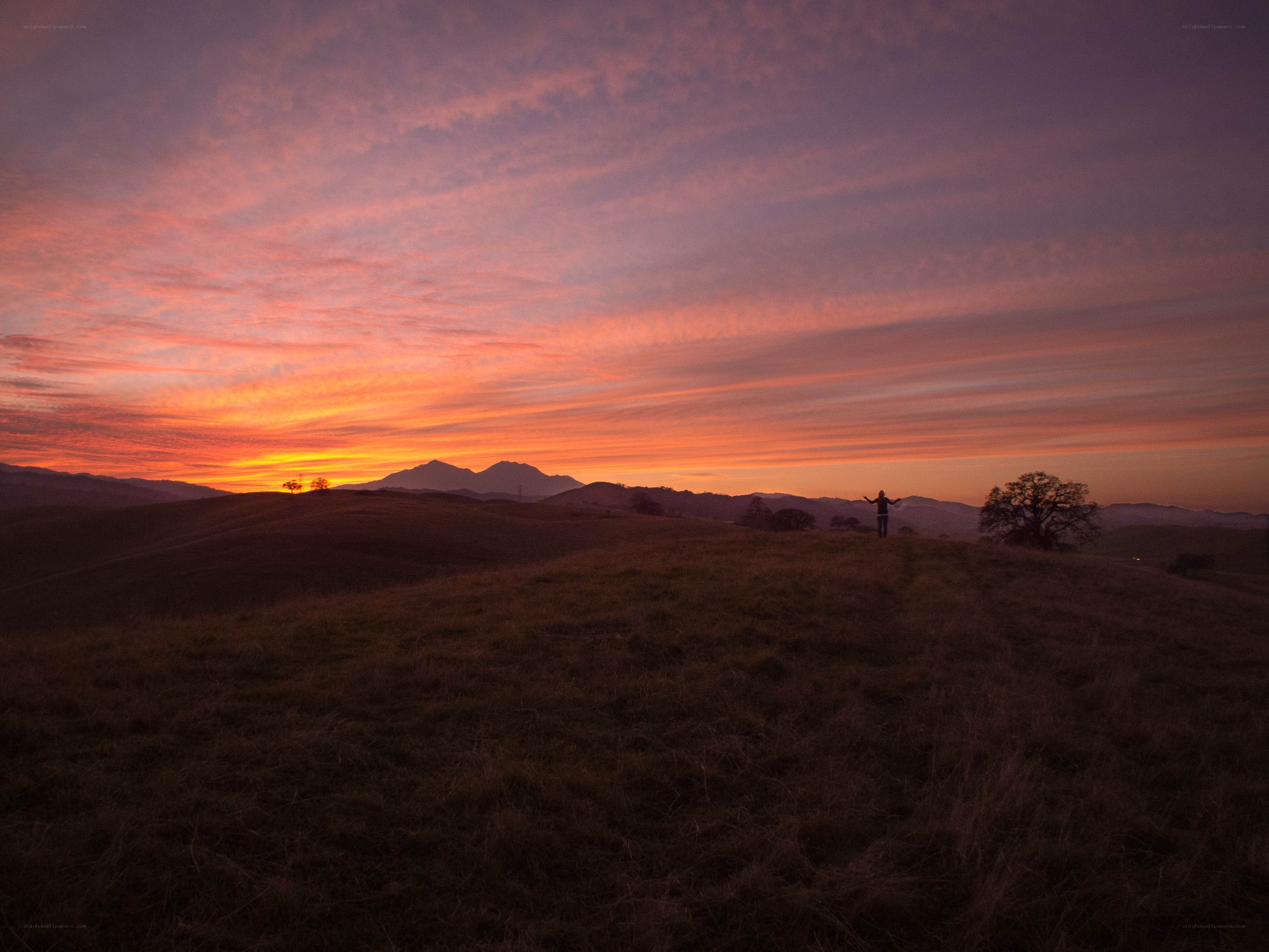 Sunset over rolling hills