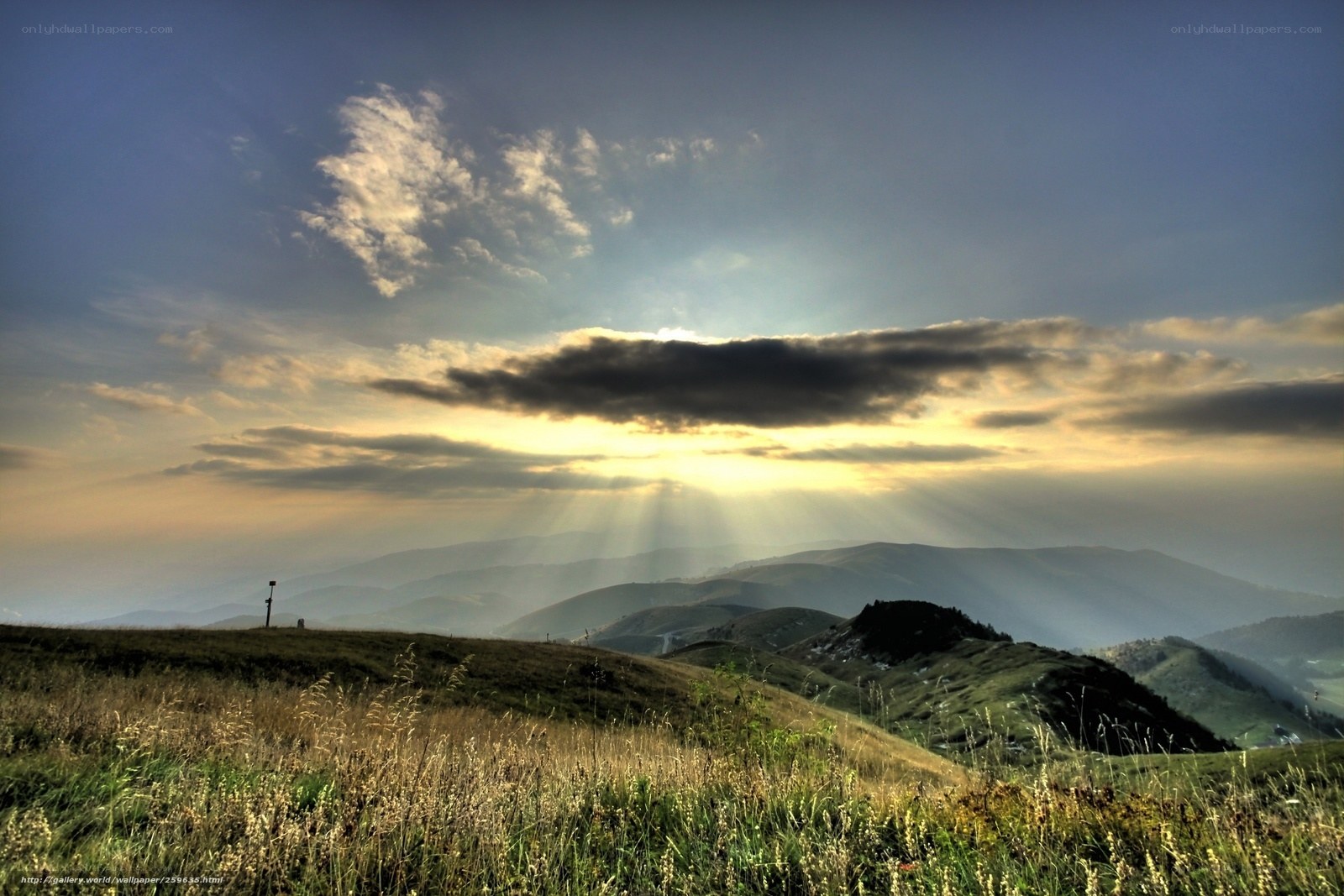 Sunset over rolling hills