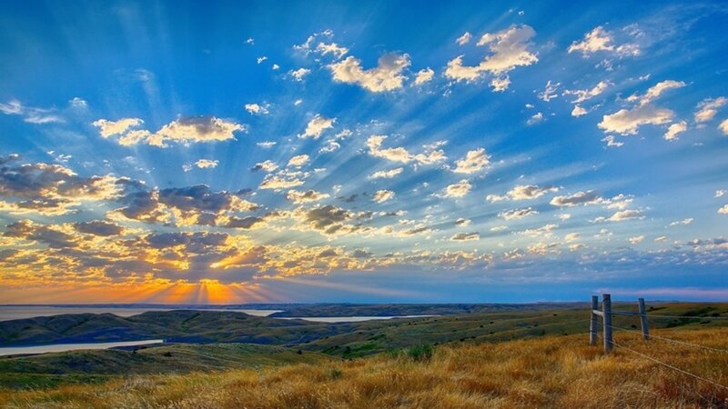 Sunset over rolling hills