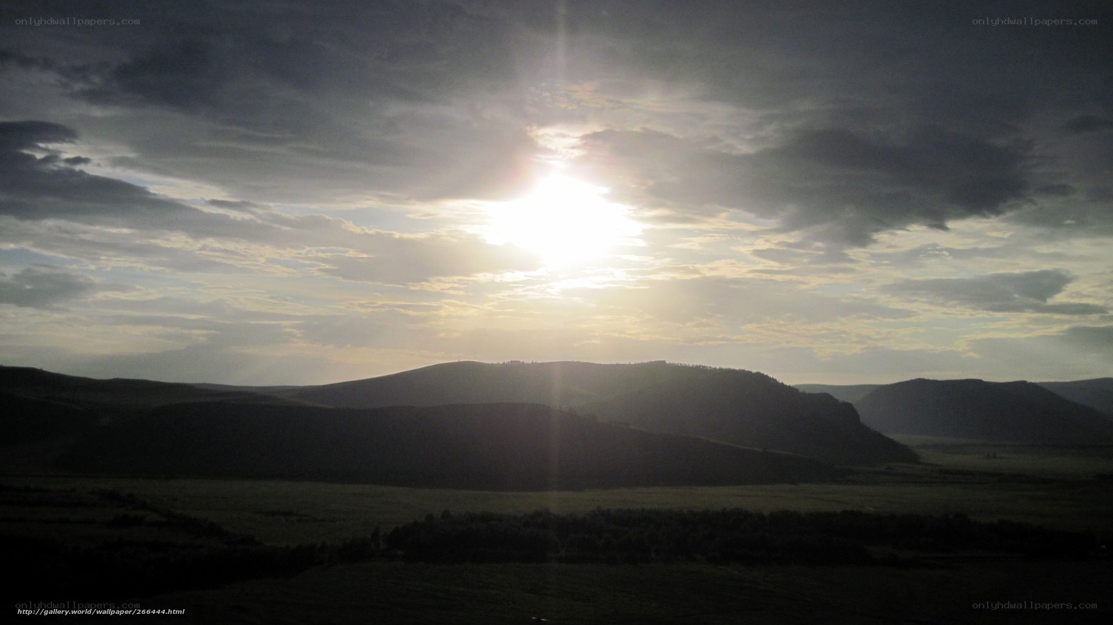 Sunset over rolling hills