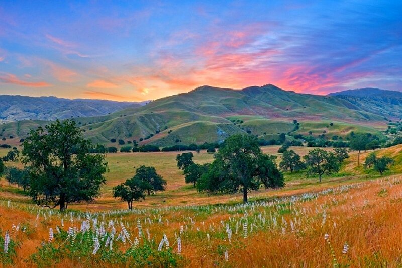 Sunset over rolling hills