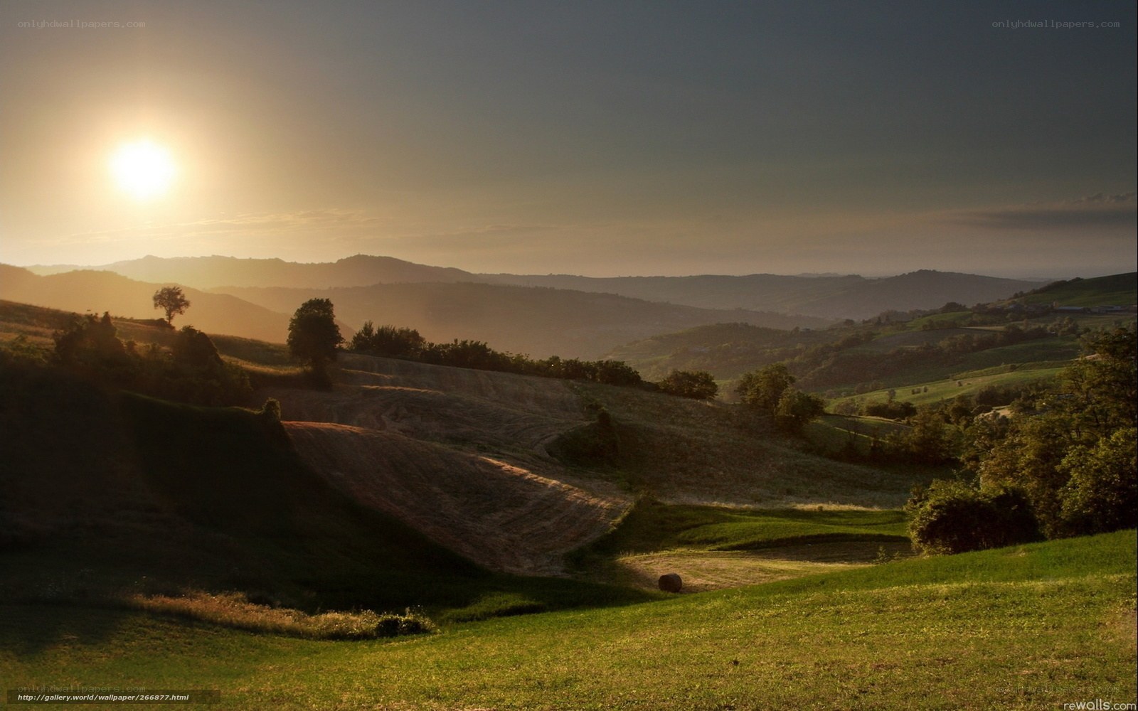 Sunset over rolling hills