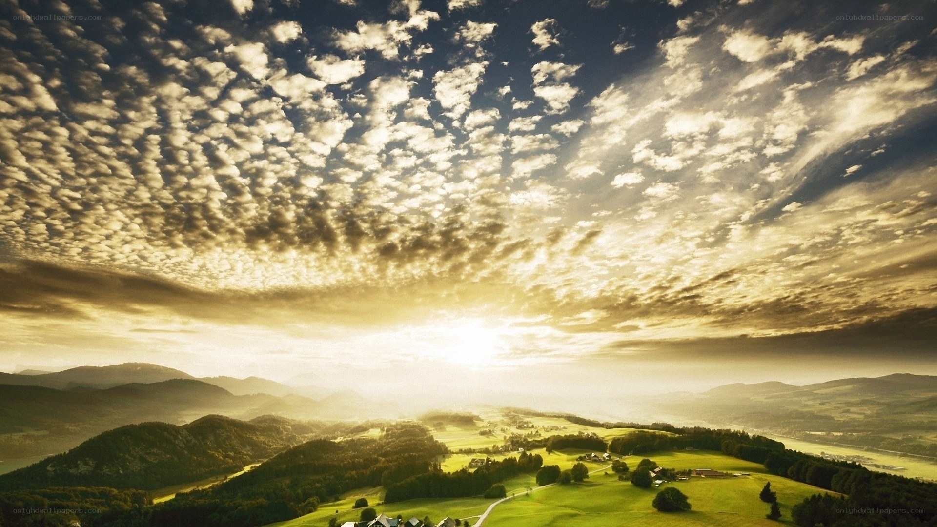 Sunset over rolling hills