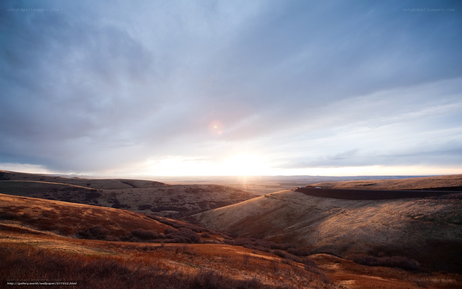 Sunset over rolling hills