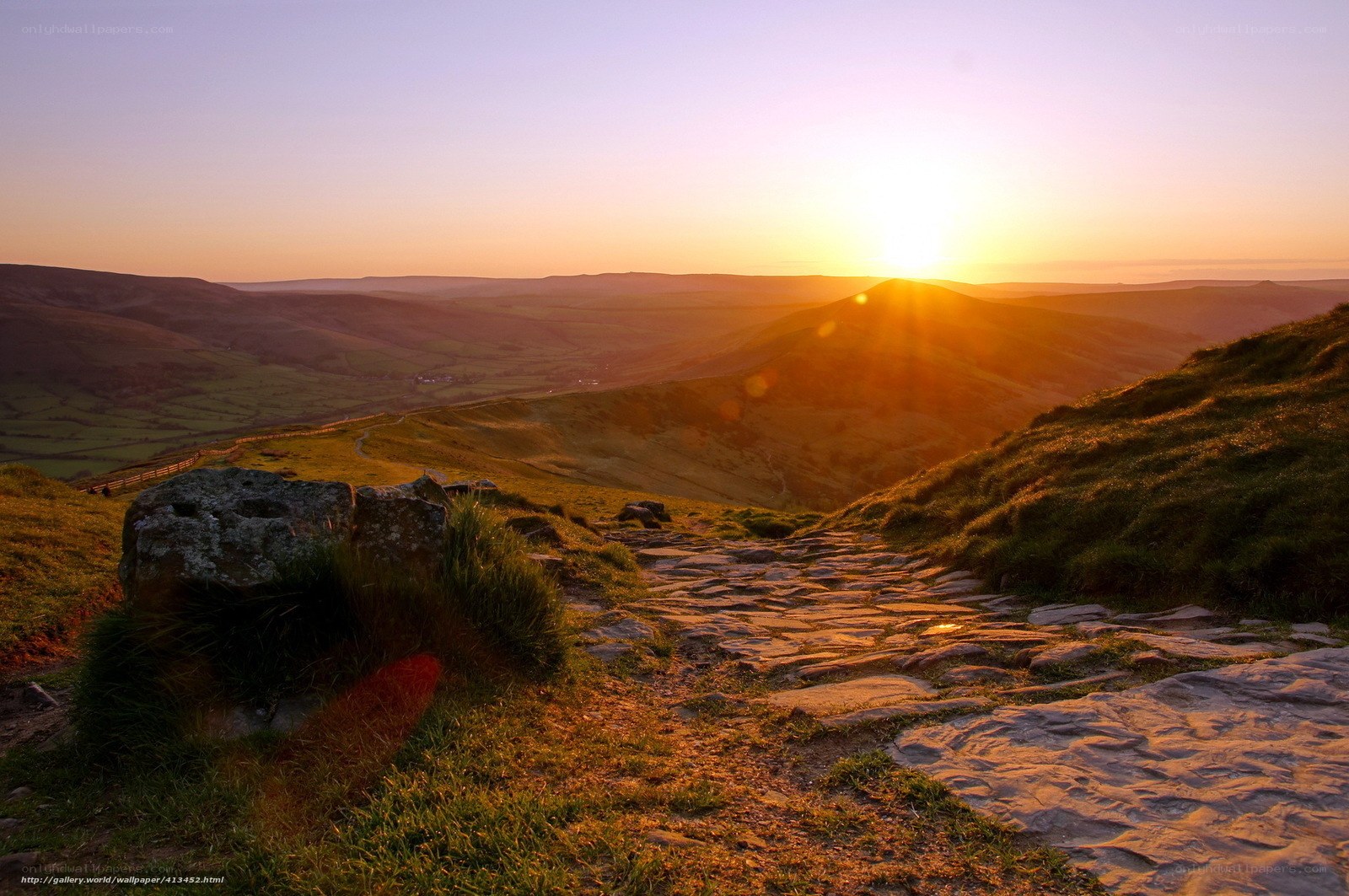 Sunset over rolling hills