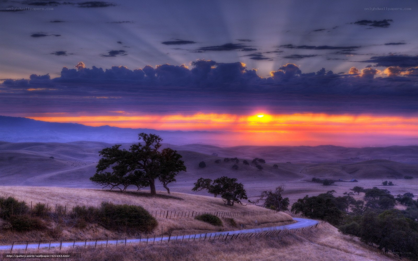 Sunset over rolling hills
