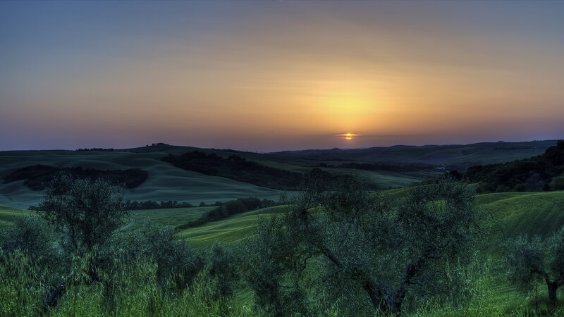 Sunset over rolling hills