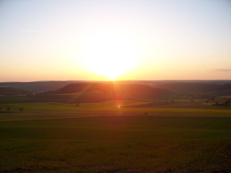 Sunset over rolling hills