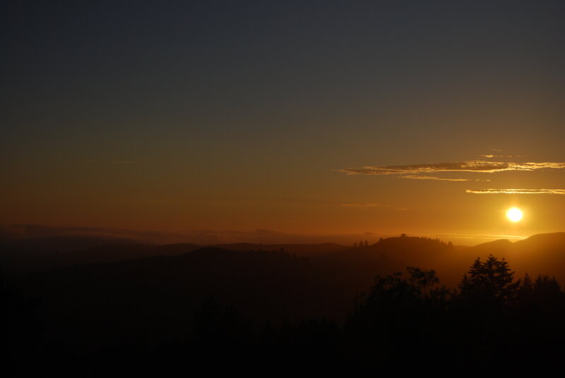 Sunset over rolling hills