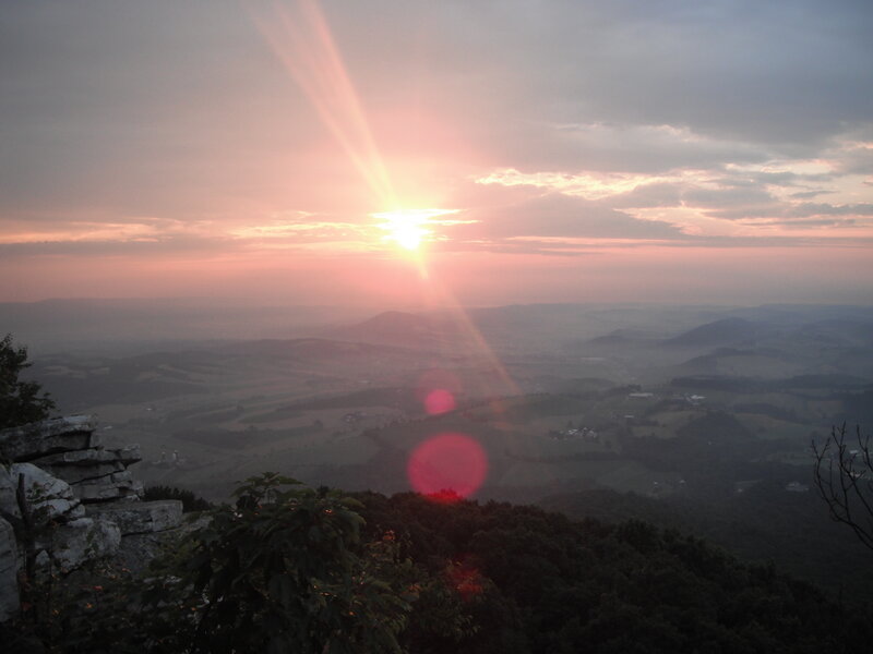 Sunset over rolling hills