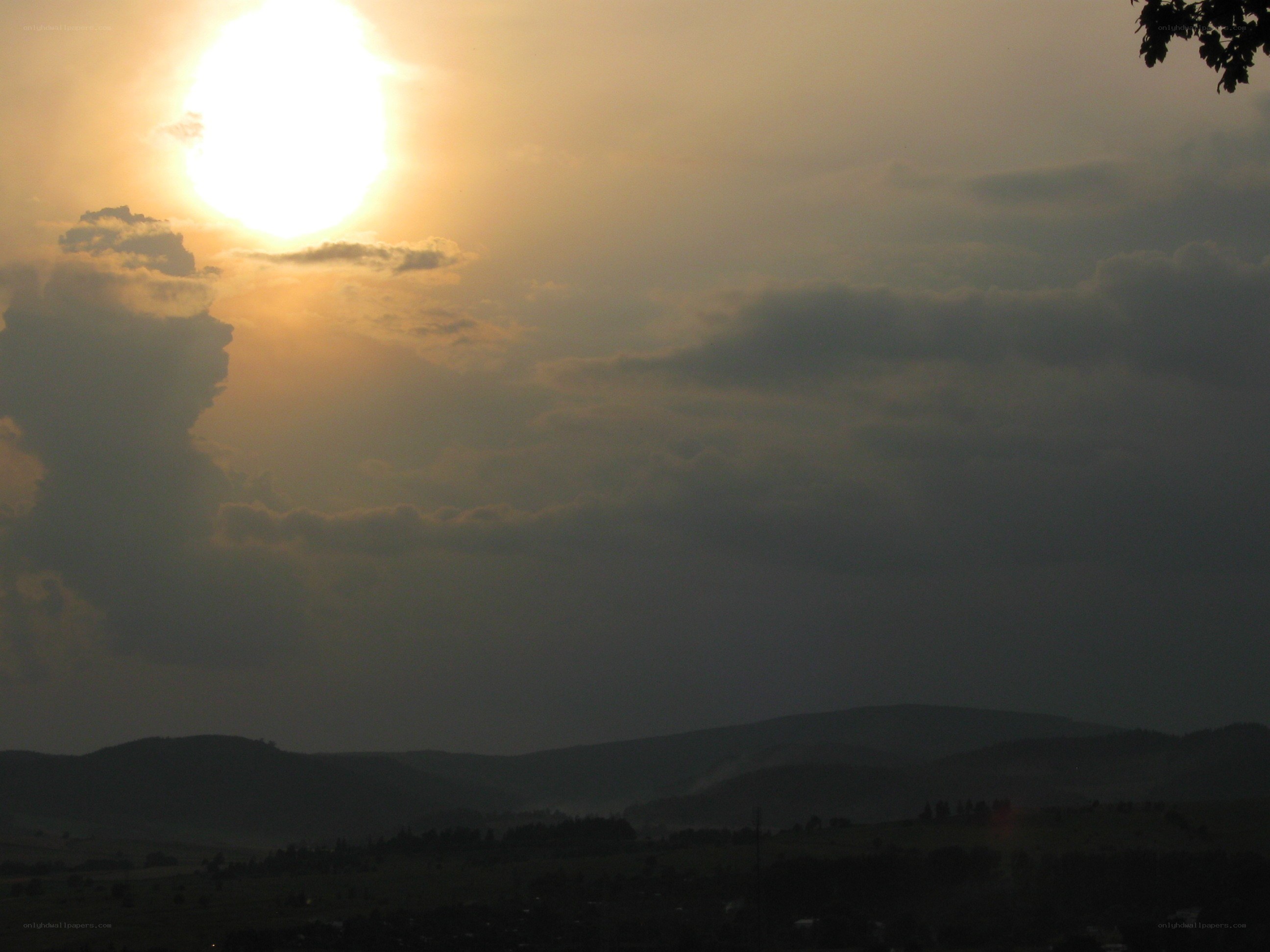 Sunset over rolling hills