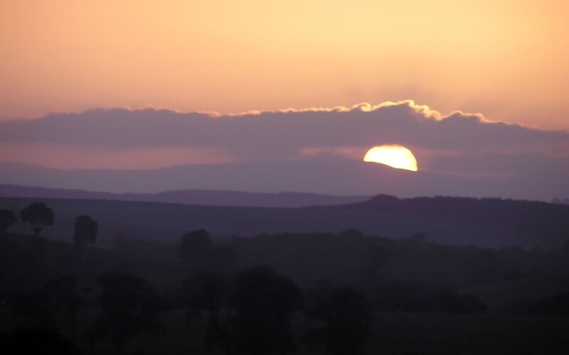 Sunset over rolling hills