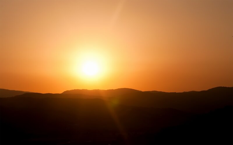 Sunset over rolling hills