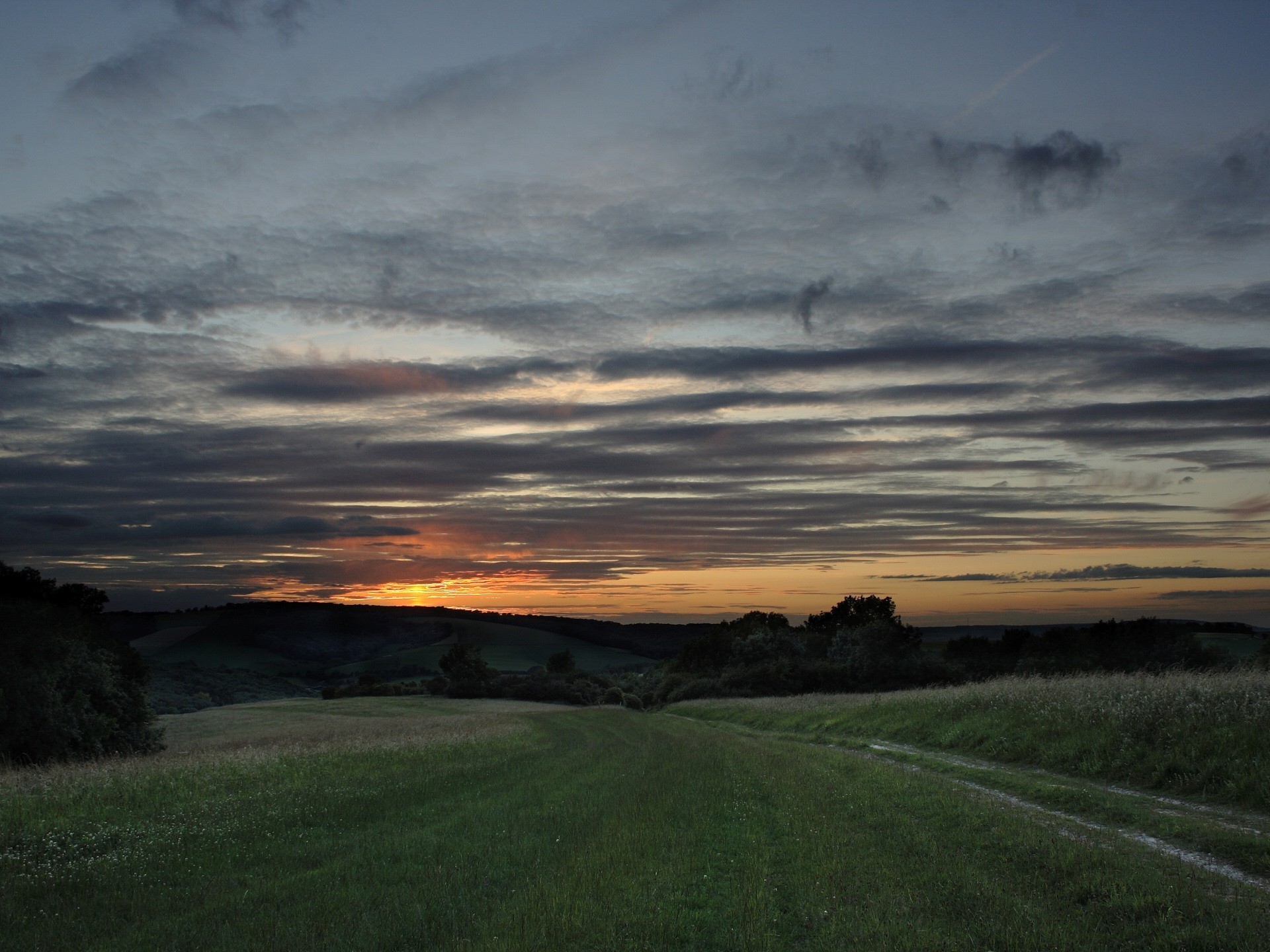 Sunset over rolling hills