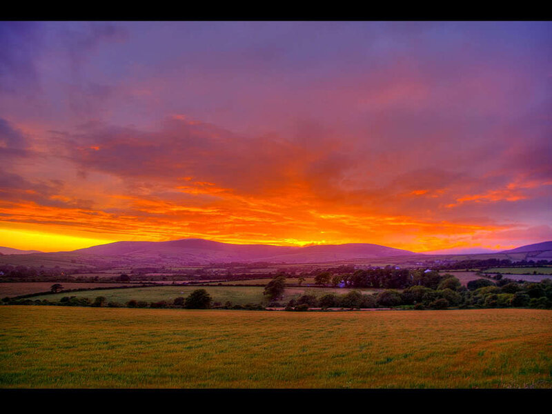 Sunset over Rolling Hills — Orange, Dramatic, Photograph, Fields