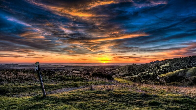 Sunset over Rolling Hills — Orange, Dramatic, Photograph, Sky, Trail Marker