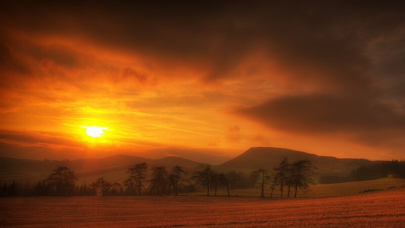 Sunset over Rolling Hills — Orange, Dramatic, Photograph, Sun