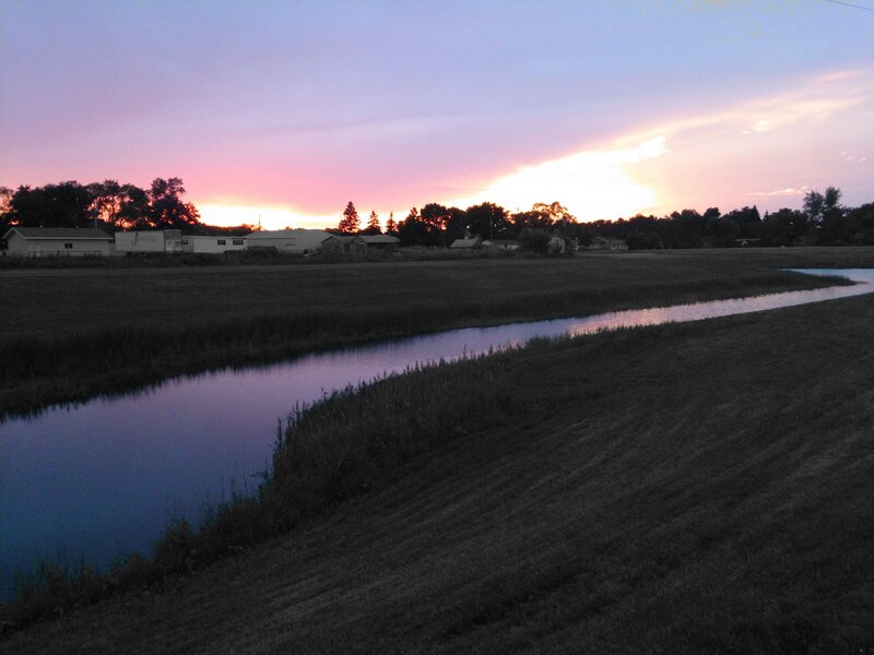 sunset over rural creek