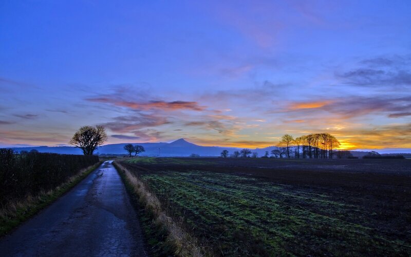 Sunset over rural landscape