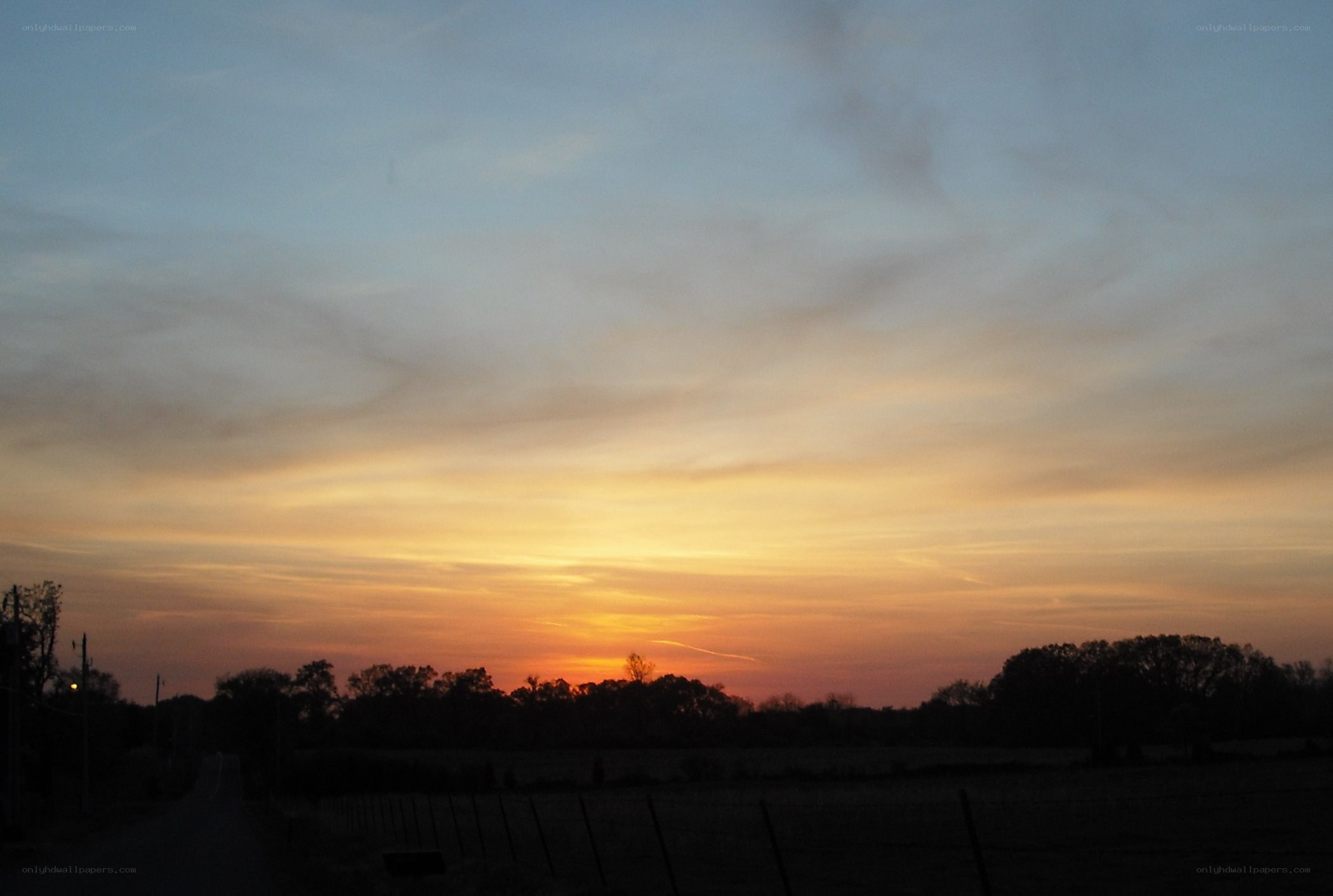 sunset over rural landscape