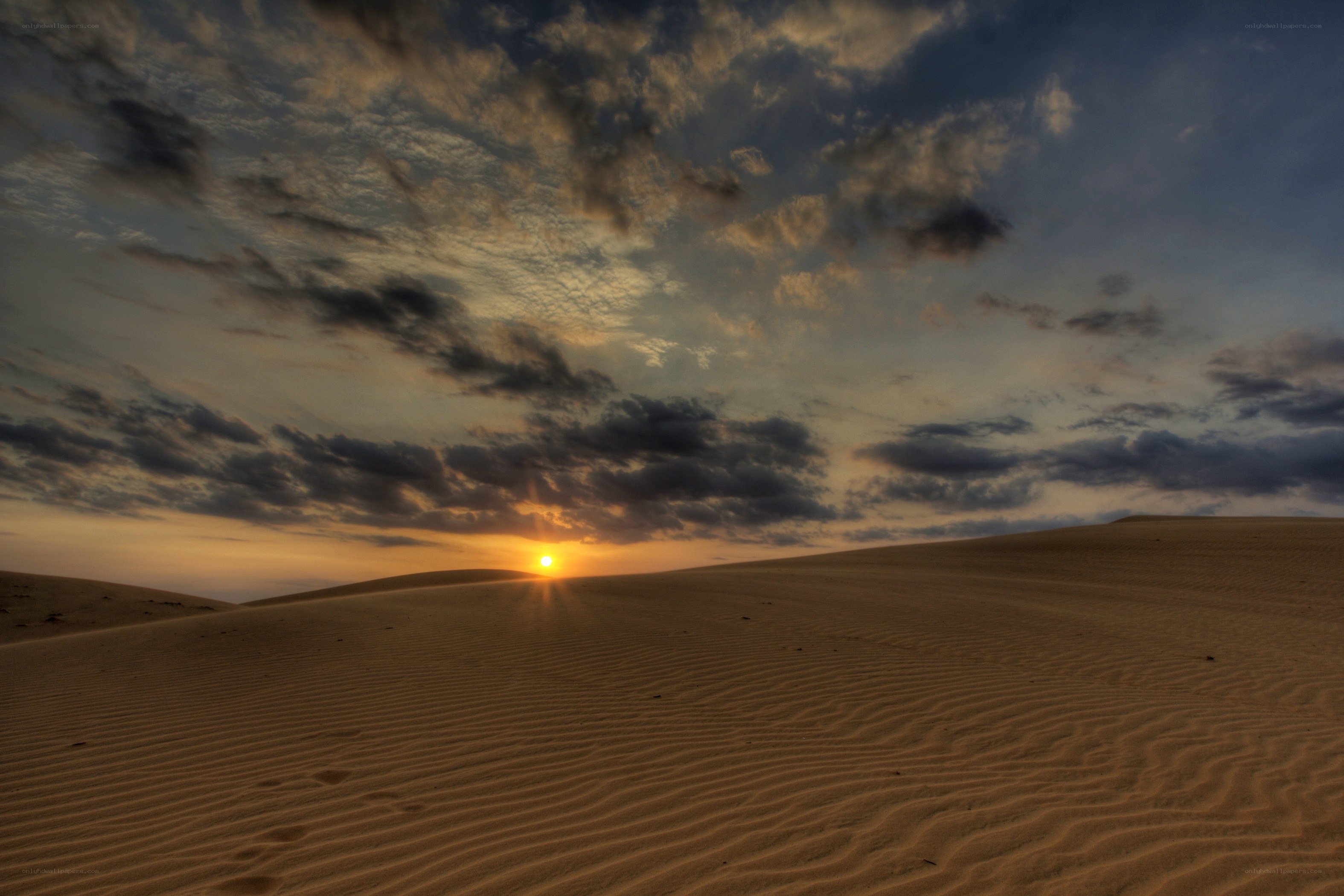 Sunset over sand dunes