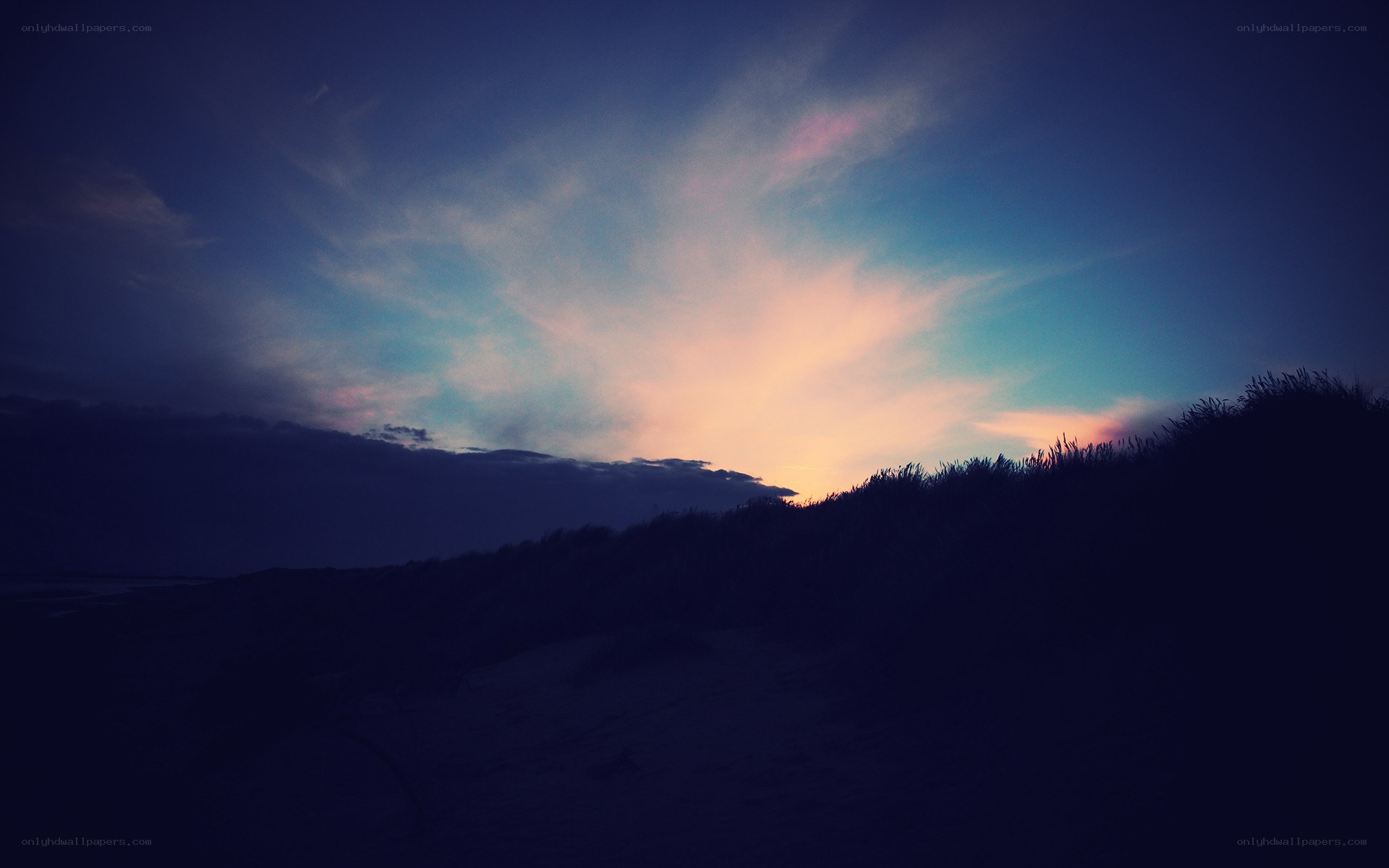 sunset over sand dunes
