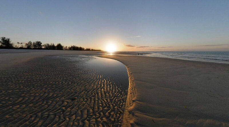 sunset over sandy beach