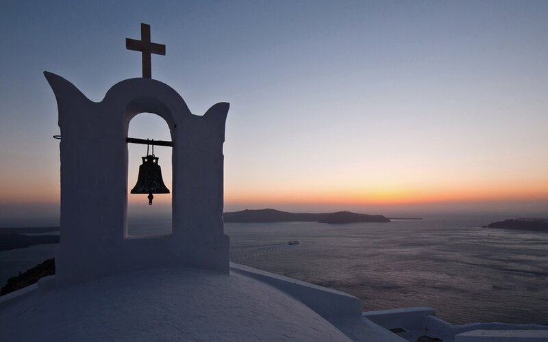 Sunset over Santorini bell tower