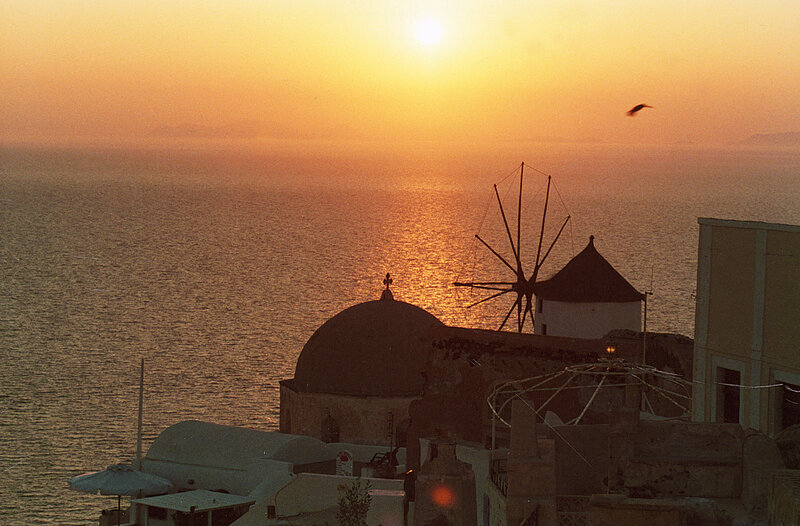 Sunset over Santorini windmill