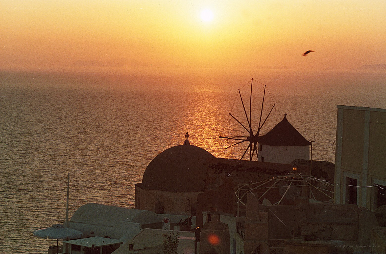 Sunset over Santorini windmill