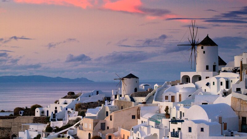 Sunset over Santorini windmills