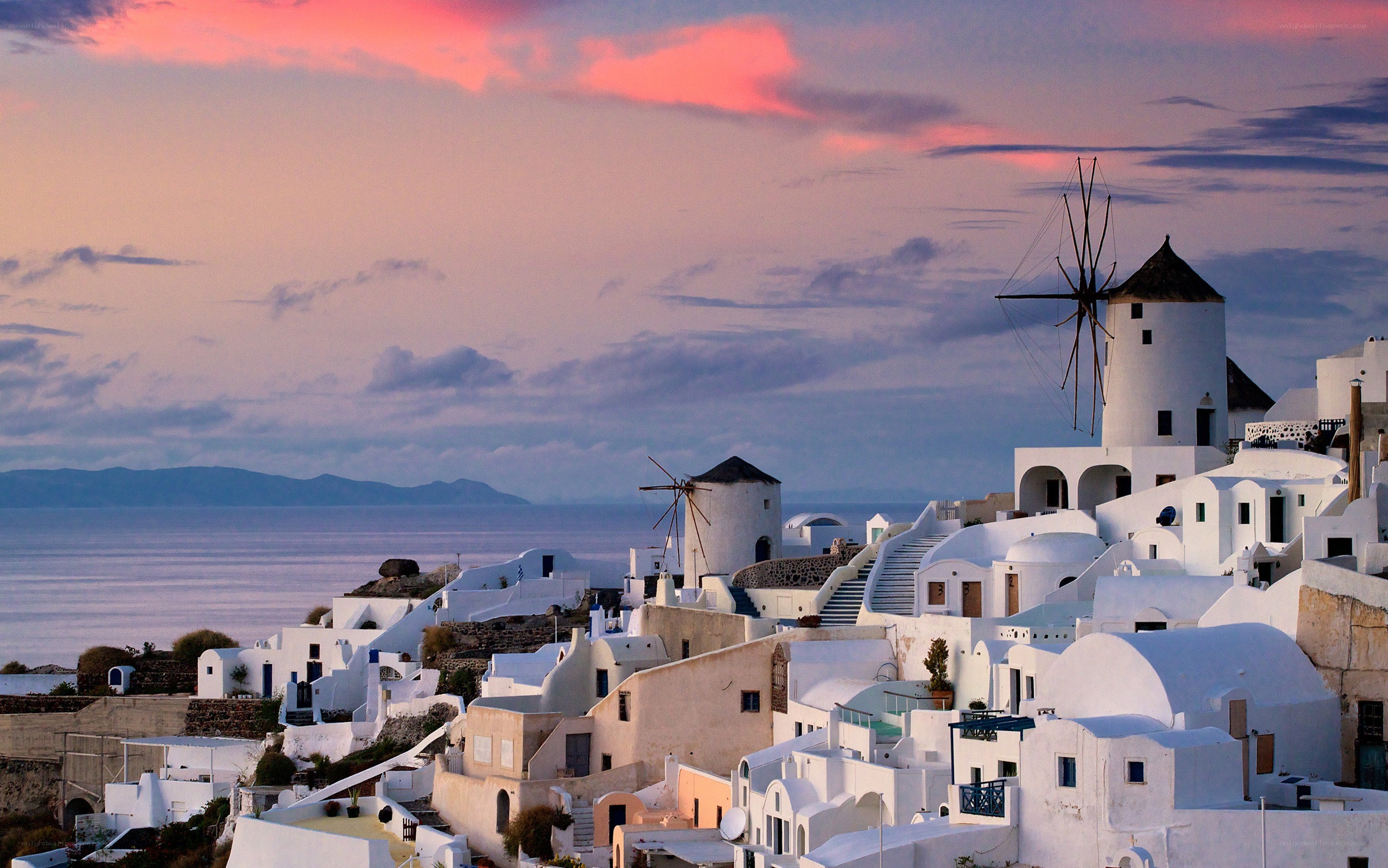 Sunset over Santorini windmills