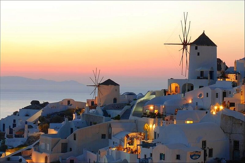 Sunset over Santorini windmills