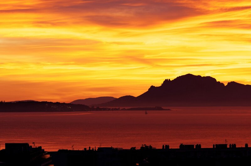 Sunset over Sea and Mountains — Orange, Dramatic, Photograph, Boat