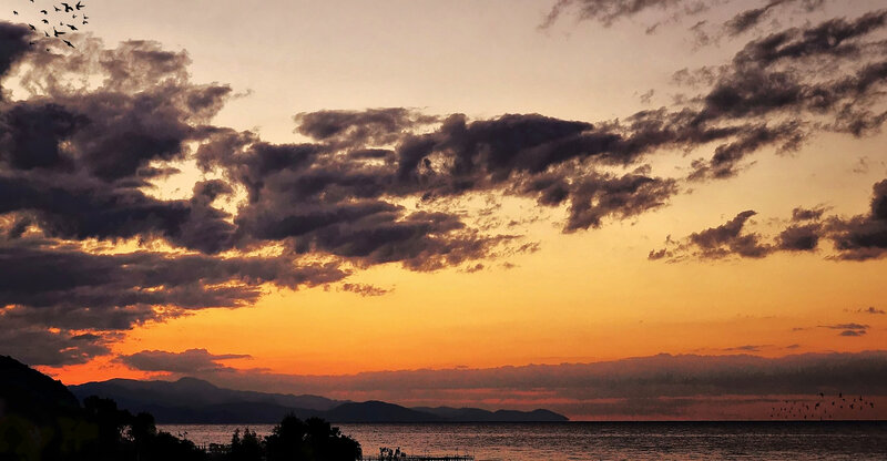 Sunset over Sea and Mountains — Orange, Dramatic, Photograph