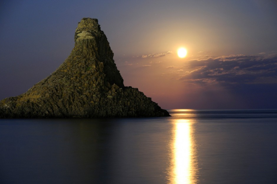 Sunset over sea rock formation
